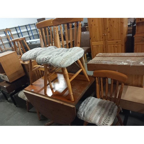 362 - A pine drop leaf dining table and four chairs