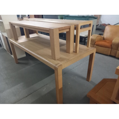 422 - A pine dining table and two pine benches