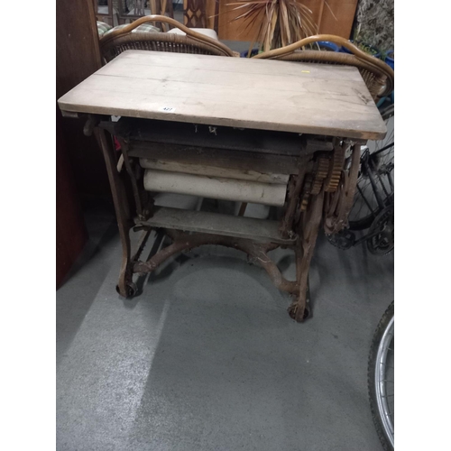 427 - A cast iron wrangle with a pine plank top