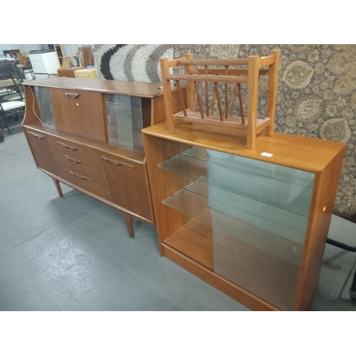 429 - A teak sideboard, bookcase and magazine rack