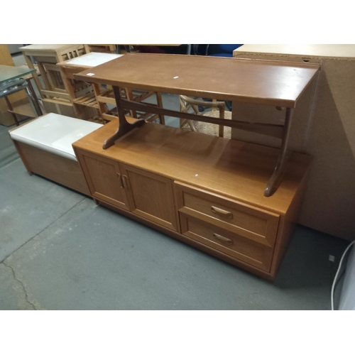 444 - An ottoman, teak sideboard and a teak coffee table