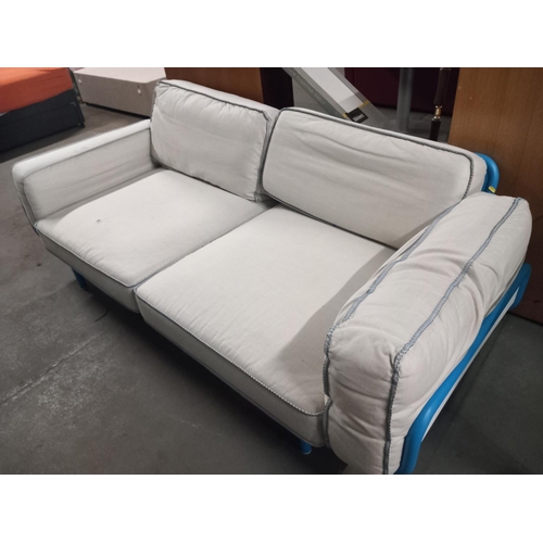 446 - A metal frame two seater sofa