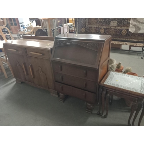 464 - An oak sideboard, bureau and a nest of tables