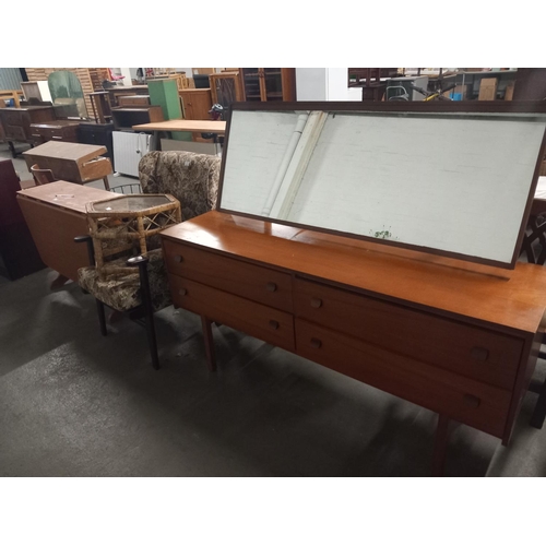 466 - A teak dressing table, armchair, drop leaf dining table etc