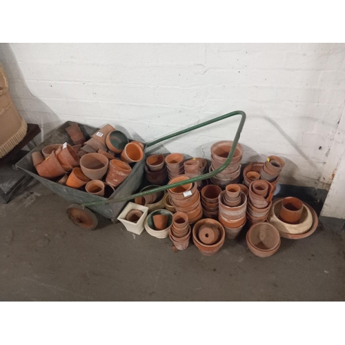 479 - A collection of terracotta planters