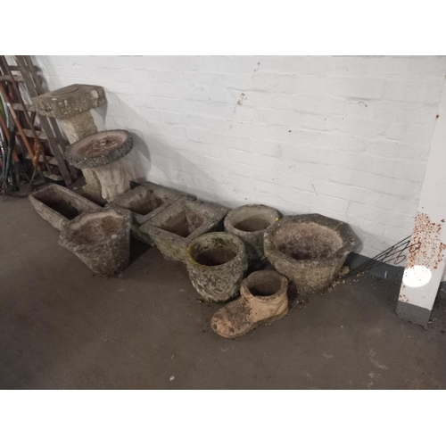 484 - A selection of stone planters, sun dial etc