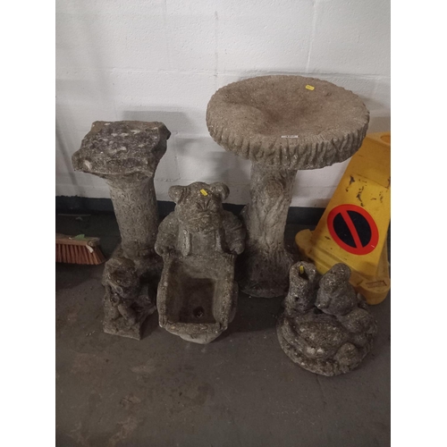 492 - Stone ornaments and a stone bird bath