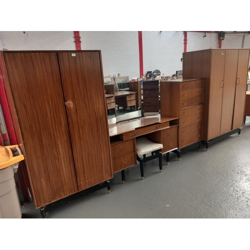 100 - A G Plan E Gomme bedroom suite consisting of two wardrobes, chest of drawers and a dressing table wi... 