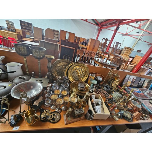 42 - A large quantity of metalware - brass, copper, silver plate, enamel, etc
