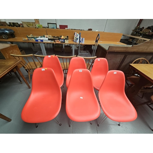 120 - Six plastic seated and chrome base chairs in the style of Vitra DSR Eames office chairs