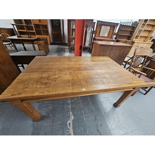 125 - A large oak dining table