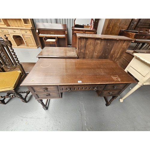 129 - An oak twin pedestal desk