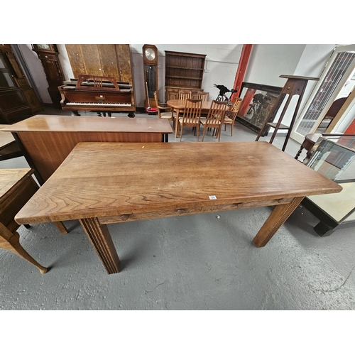 132 - An oak plank top table with two drawers
Dimensions: 
183cm long x 79cm wide x 78cm high