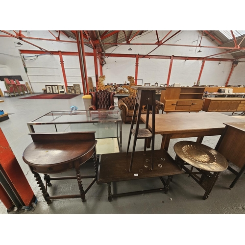 134 - A coffee table, pot stand, bow fronted cabinet and a copper top folding table