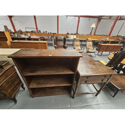 137 - An oak bookcase and an oak cabinet