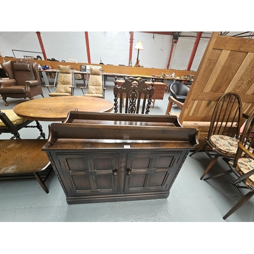 139 - An Ercol cupboard and a plate rack