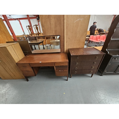 144 - A teak dressing table and a chest of drawers