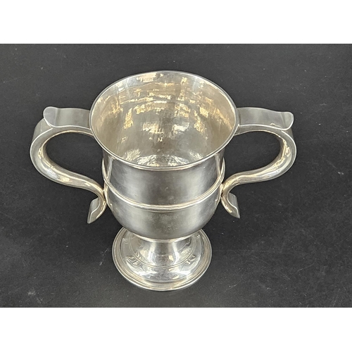 201 - A hallmarked silver twin handled cup - London hallmarks - 1775 - weight 396 grams, height 14 cm