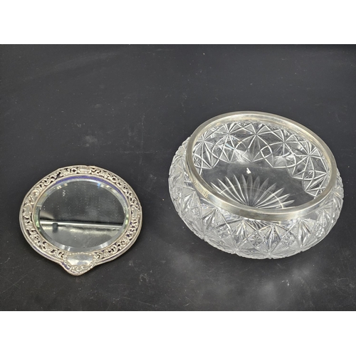 219 - A cut glass salad bowl with a silver rim and a silver framed mirror