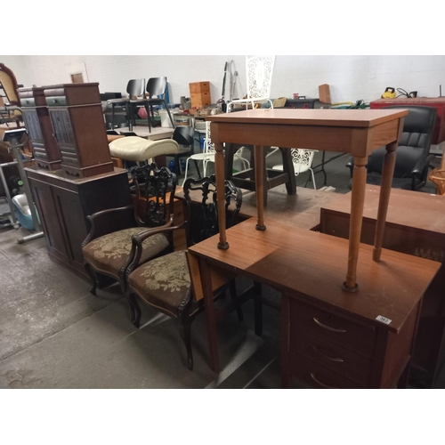 363 - A single pedestal desk, two armchairs, mahogany cupboard etc