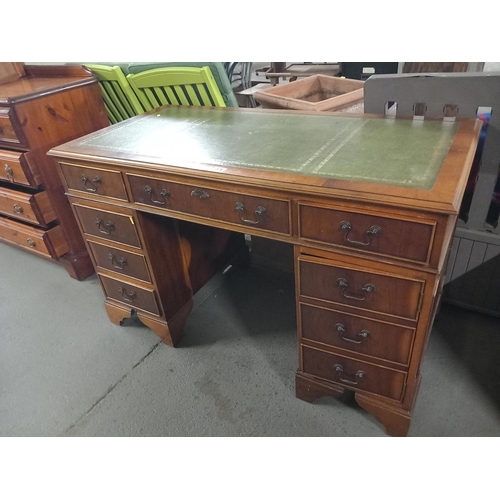 376 - A twin pedestal desk with leatherette insert