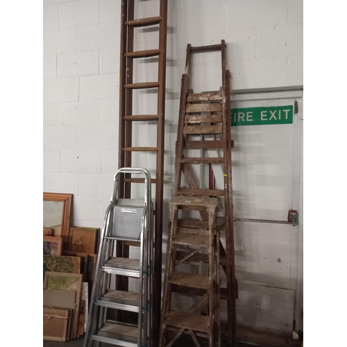 479 - Three aluminium step ladders, two wooden step ladders and one extension ladder