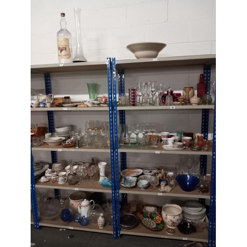 482 - Ten shelves of china and glassware including Famous Grouse whisky bottle, bohemia glasses, part tea ... 