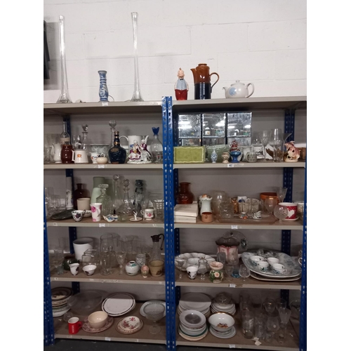 483 - Ten shelves of china and glassware including decanters, ornaments, meat platters etc