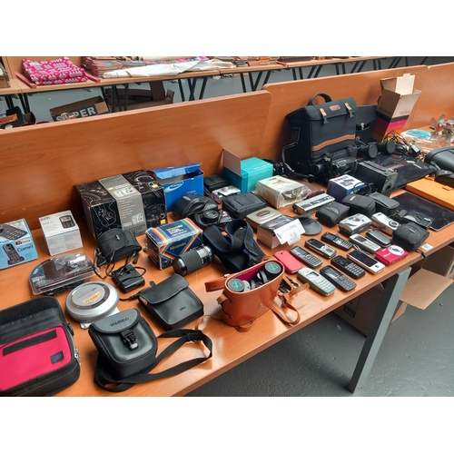 67 - Binoculars, cameras, mobile phones, a Toshiba laptop etc (all untested)