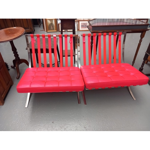 120 - Two red leather chrome frame barcelona style chairs (each chair missing one cushion)