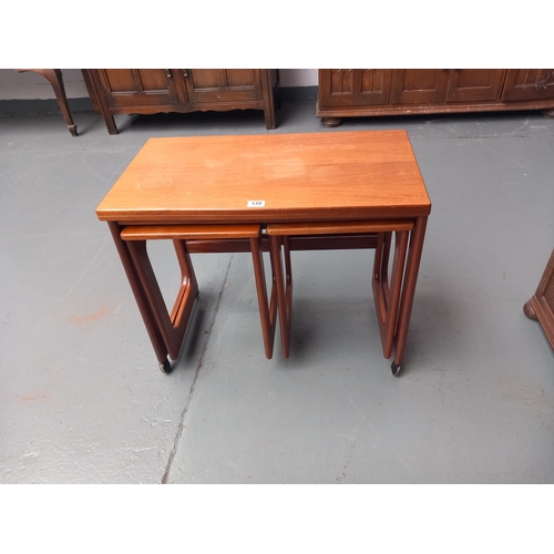 139 - A teak twist top nest of tables