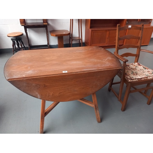 141 - An ercol drop leaf dining table and one ercol carver dining chair