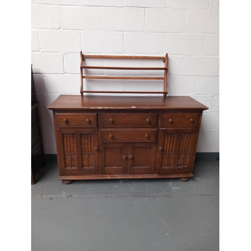 145 - An Ercol sideboard and an ercol plate rack