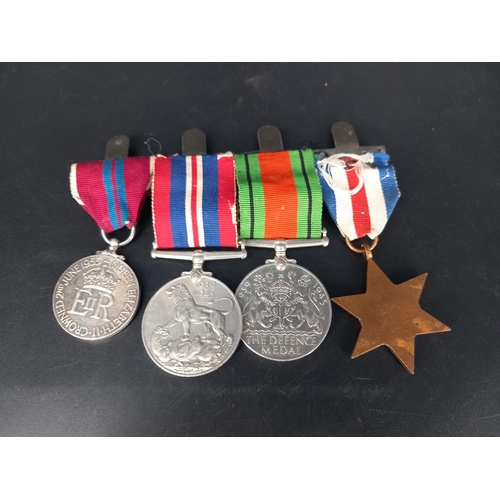 222 - A group of 4 world war 2 medals - the France and Germany star, the Defence medal, the War medal and ... 