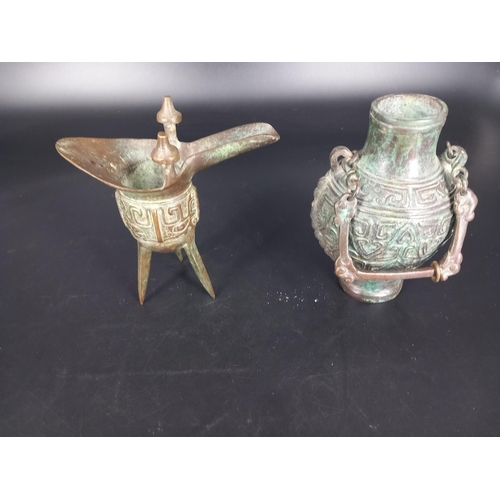 228 - Two bronze Chinese wine pourers