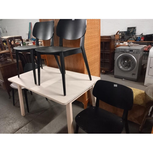 371 - An Ieak Norraker dining table and four chairs