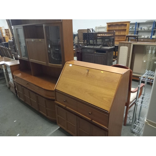 395 - A teak Nathan wall unit, a teak Parker Knoll bureau and a teak cabinet