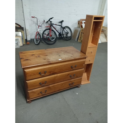 445 - A pine chest of drawers and a pine effect CD rack