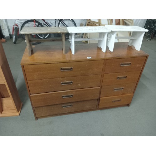 449 - A teak double chest of drawers and three footstools