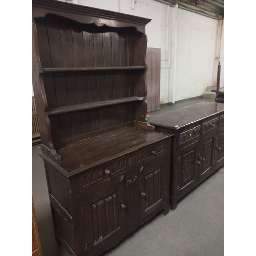 452 - An oak dresser and an oak sideboard