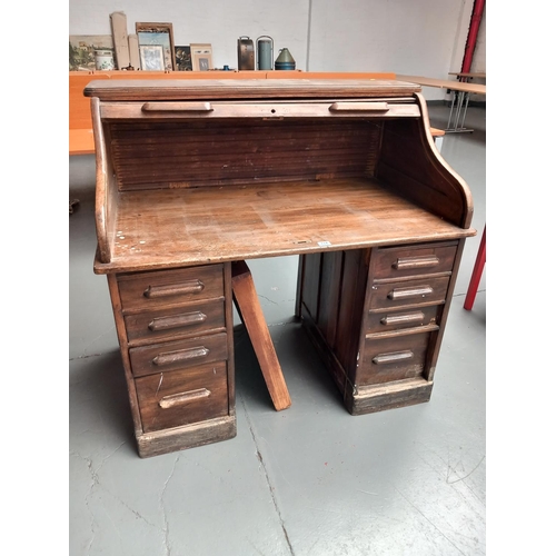 114 - An oak roll top desk