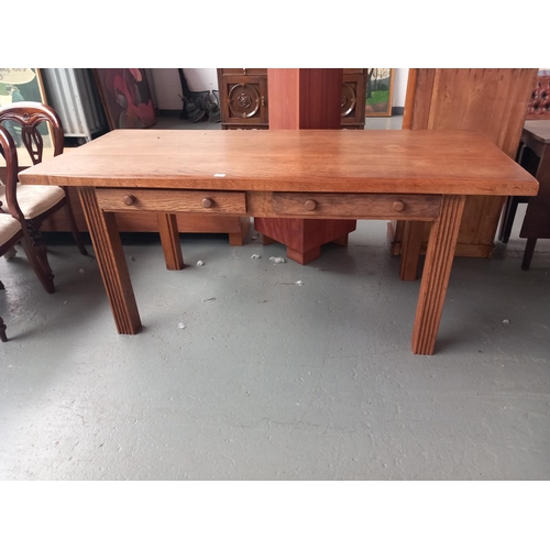 127 - An oak plank top table with two drawers
Dimensions: 
183cm long x 79cm wide x 78cm high