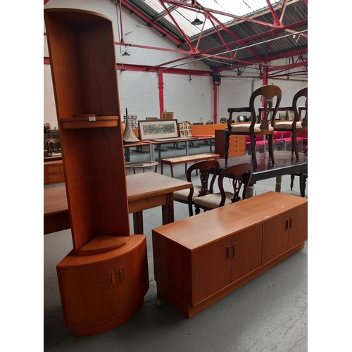 130 - A teak corner cabinet and a teak sideboard