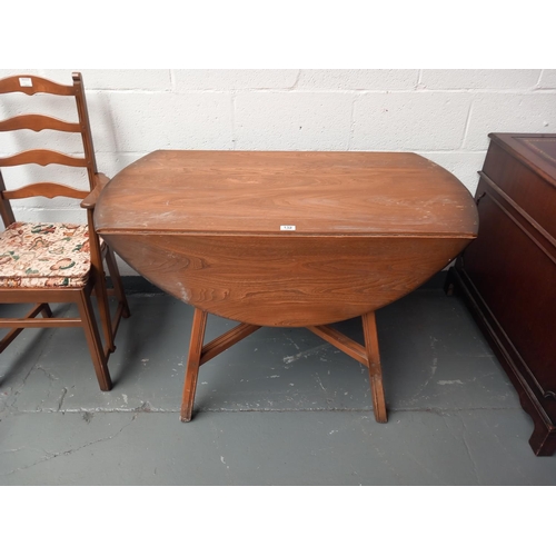 132 - An ercol drop leaf dining table and one ercol carver dining chair