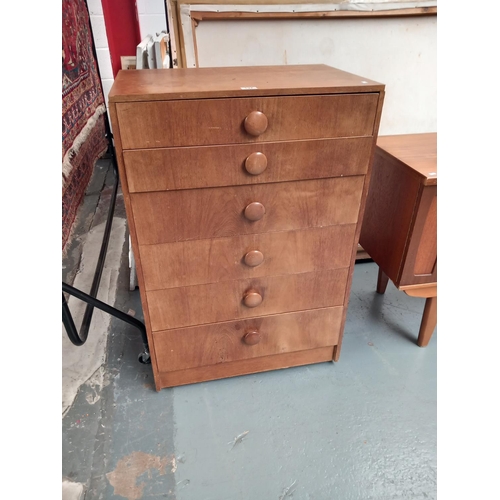 137 - A teak chest of drawers