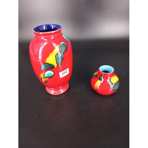 212 - Two volcanic Poole pottery vases one being 18 inches tall and the other being 4 inches tall