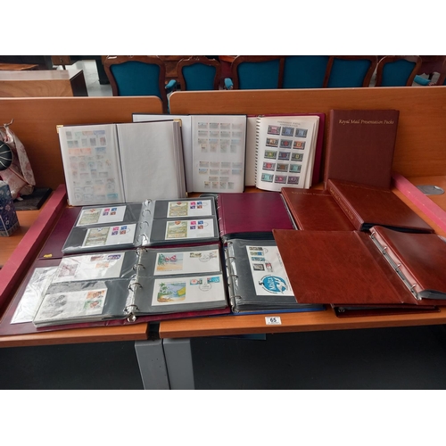 65 - Stamp albums - containing stamps from Gibraltar, Isle of Man, Guernsey etc first day covers and empt... 