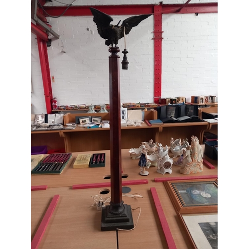 73 - A antique floor lamp - bronze base with mahogany column and bronze eagle top