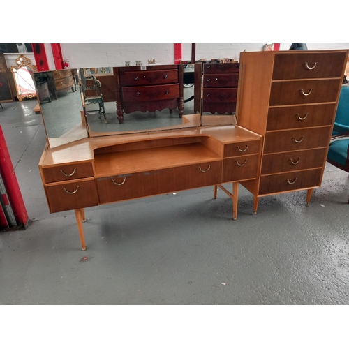 100 - A mid century dressing table with matching chest of drawers