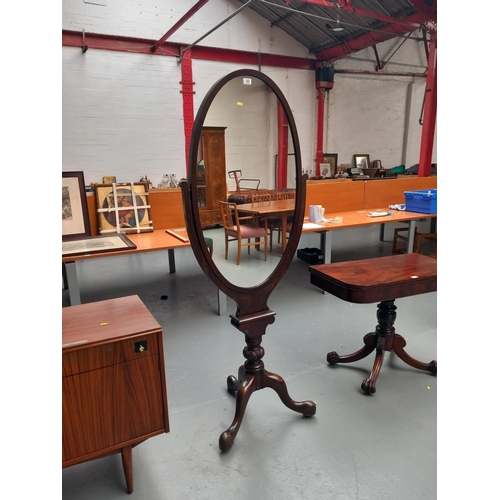 103 - A victorian mahogany cheval mirror on tripod base